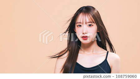 Image of hair care, cosmetics, and skin care of a woman with her hair blowing in the wind Image of hair care, cosmetics, and skin care of a woman with her hair blowing in the wind 108759060