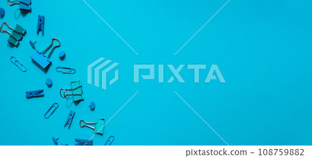 Monochromatic look Frame border made of school stationery office supplies. Copy space for your text or Educational greeting announcement for students and teacher. Creative vivid blue background 108759882