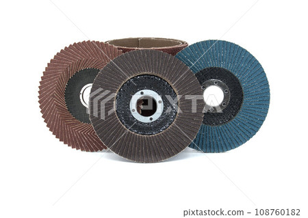 Several sanding discs in close-up view over white 108760182