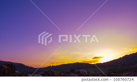 Violet purple sky in morning scenery Vibrant colorful blue sky summer time on sunrise. Natural beautiful landscape. Beauty purple sky romantic dramatic landscape cloudy outdoor paradise in sunset Violet purple sky in morning scenery Vibrant colorful blue sky summer time on sunrise. Natural beautiful landscape. Beauty purple sky romantic dramatic landscape cloudy outdoor paradise in sunset 108760724