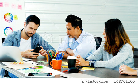 Happiness diversity business team meeting corporate office desk in company meeting room. Asian team group partner brainstorming discussion multiethnic people sitting share ideas teamwork in boardroom 108761100