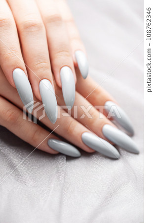 Grey nails on grey lace background. Grey nails on grey lace background. 108762346