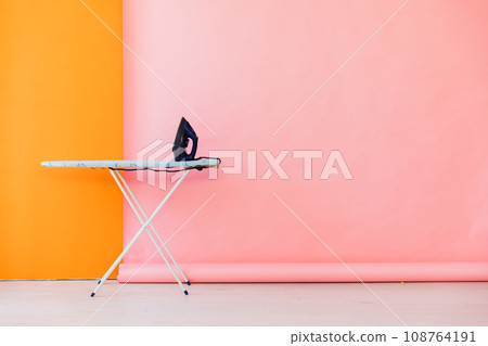 Room interior with ironing board and iron 108764191