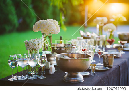 A bowl of ice cubes on the banquet table. A bowl of ice cubes on the banquet table. 108764993