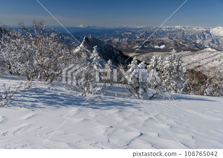 Mt. Asama seen from the mountain trail of Mt. Kengamine in winter Mt. Asama seen from the mountain trail of Mt. Kengamine in winter 108765042