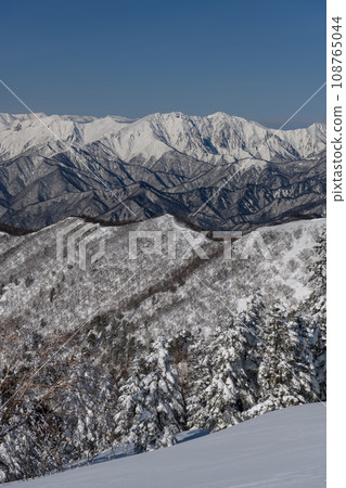 Mt. Tanigawa seen from the mountain trail of Mt. Kengamine in winter Mt. Tanigawa seen from the mountain trail of Mt. Kengamine in winter 108765044