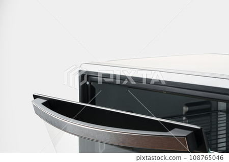 Close up of black mini electric oven home appliance Close up of black mini electric oven home appliance 108765046