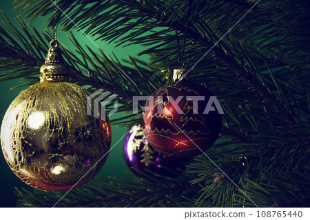 Christmas composition. Balls on a Christmas tree close-up Christmas composition. Balls on a Christmas tree close-up 108765440