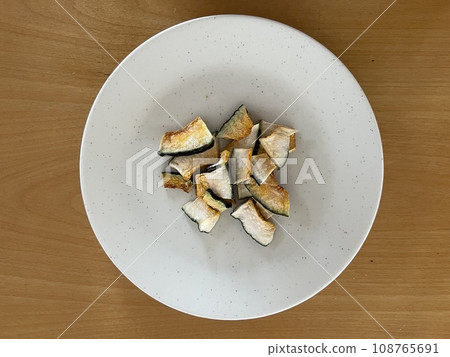 Dried vegetables on a plate - pumpkin 108765691