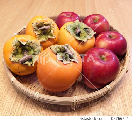 Apples and persimmons - autumn fruit Apples and persimmons - autumn fruit 108766755