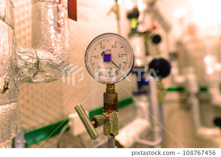 Pressure sensor in an industrial boiler room. Barometer in the heating system. Close-up. 108767456
