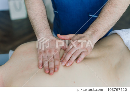 Anti-cellulite foot massage for a fat woman. Concept of personal care, weight loss, diet. Close-up. Anti-cellulite foot massage for a fat woman. Concept of personal care, weight loss, diet. Close-up. 108767520