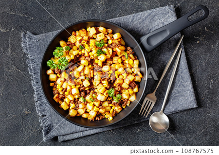 Beef Hash with roasted corn, garlic and parsley 108767575