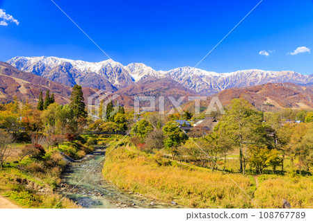 Three-tiered autumn leaves of Hakuba Sanzan seen from Hakuba Oide Park in autumn Three-tiered autumn leaves of Hakuba Sanzan seen from Hakuba Oide Park in autumn 108767789