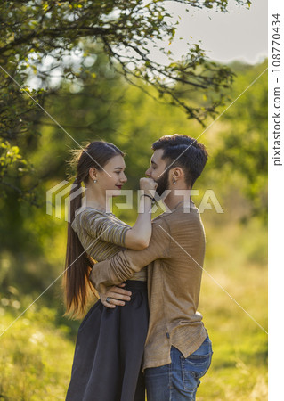 young couple hugging in nature young couple hugging in nature 108770434
