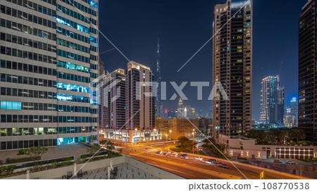 Aerial panoramic view to Dubai downtown and difc skyscrapers day to night timelapse. Aerial panoramic view to Dubai downtown and difc skyscrapers day to night timelapse. 108770538