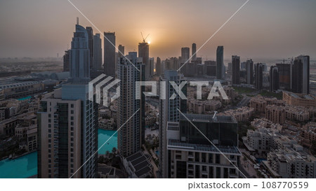 Aerial panoramic view of a big futuristic city night to day timelapse. Business bay and Downtown 108770559
