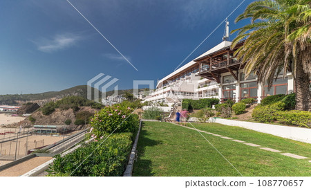 Panorama showing the coastline of the village of Sesimbra timelapse. Portugal Panorama showing the coastline of the village of Sesimbra timelapse. Portugal 108770657