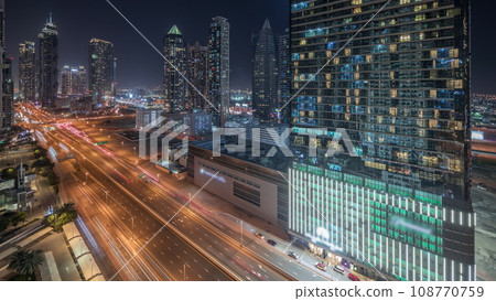 Panorama showing business bay district skyline with modern architecture night timelapse from above. 108770759