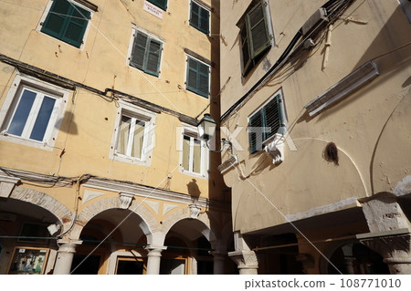 Street view of Kerkyra, capital of Corfu island, Greece. View of Kerkyra with beautiful buildings during summer sunny day 108771010