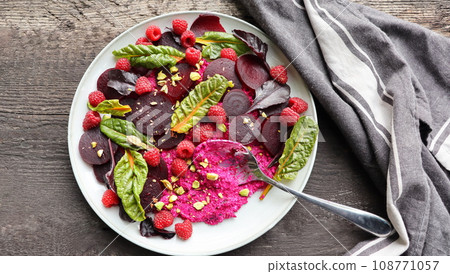 Healthy Beet Salad with raspberry, red pray, nuts Healthy Beet Salad with raspberry, red pray, nuts 108771057