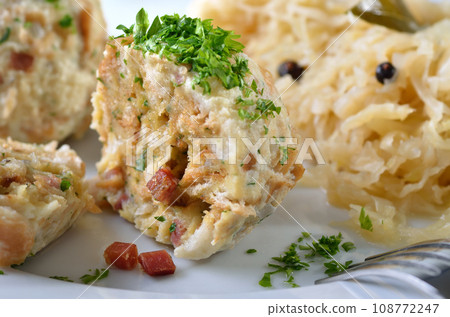 Homemade South Tyrolean bacon dumplings with sauerkraut Homemade South Tyrolean bacon dumplings with sauerkraut 108772247