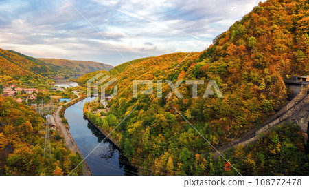 river flows among the forested area of carpathian mountains. autumnal countryside tourism background 108772478