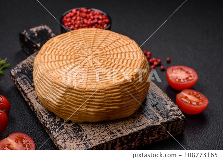 Delicious hard craft cheese made from cow or goat milk 108773165