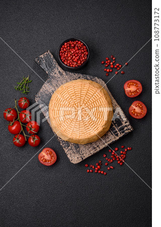 Delicious hard craft cheese made from cow or goat milk Delicious hard craft cheese made from cow or goat milk 108773172