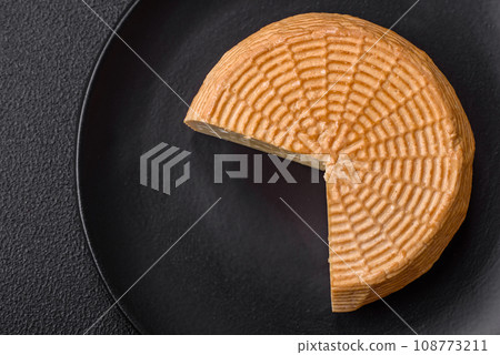 Delicious hard craft cheese made from cow or goat milk Delicious hard craft cheese made from cow or goat milk 108773211