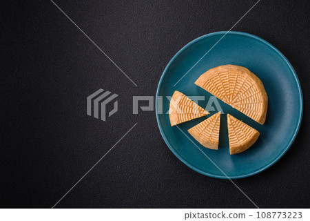 Delicious hard craft cheese made from cow or goat milk 108773223
