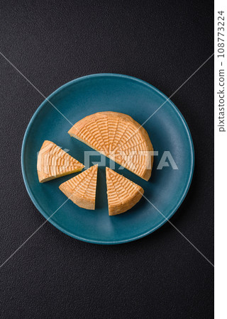 Delicious hard craft cheese made from cow or goat milk 108773224