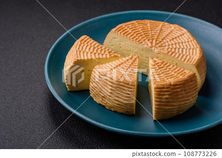 Delicious hard craft cheese made from cow or goat milk 108773226