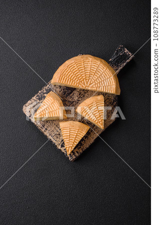 Delicious hard craft cheese made from cow or goat milk 108773289