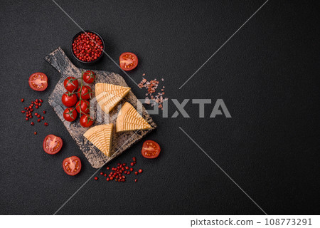 Delicious hard craft cheese made from cow or goat milk Delicious hard craft cheese made from cow or goat milk 108773291