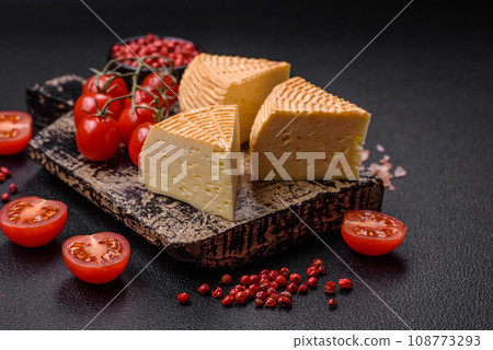 Delicious hard craft cheese made from cow or goat milk 108773293
