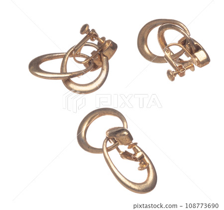 Fashion gold Earrings with beautiful work detail is value. Luxury golden earring is fashion trend and fly in air. White background isolated Fashion gold Earrings with beautiful work detail is value. Luxury golden earring is fashion trend and fly in air. White background isolated 108773690