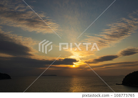 The setting sun over the Seto Inland Sea and Ibuki Island The setting sun over the Seto Inland Sea and Ibuki Island 108773765