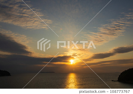 The setting sun over the Seto Inland Sea and Ibuki Island The setting sun over the Seto Inland Sea and Ibuki Island 108773767