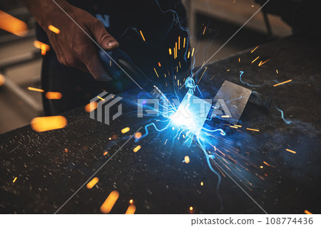 Male worker hand welding steel rack Male worker hand welding steel rack 108774436