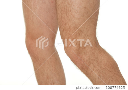 male legs close up on white studio background. knee 108774625
