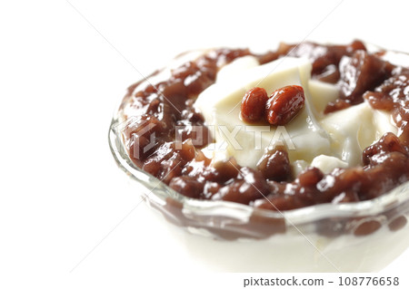 A photo of plenty of red bean paste and almond tofu served in a dessert cup against a white background A photo of plenty of red bean paste and almond tofu served in a dessert cup against a white background 108776658