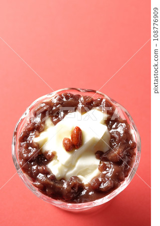 An overhead shot of plenty of red bean paste and almond tofu served in a dessert cup An overhead shot of plenty of red bean paste and almond tofu served in a dessert cup 108776909