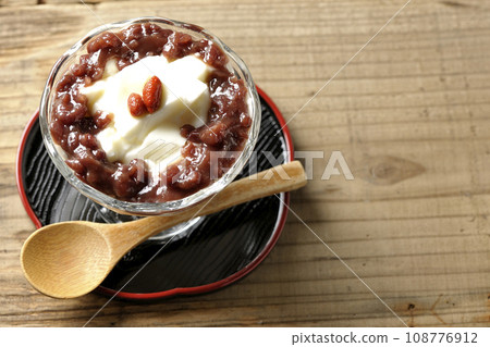 An overhead shot of plenty of red bean paste and almond tofu served in a dessert cup An overhead shot of plenty of red bean paste and almond tofu served in a dessert cup 108776912