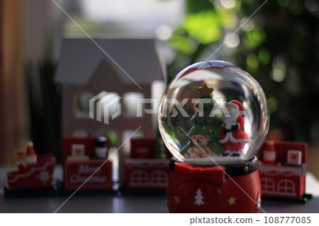 Snow Globe with Santa Claus. Christmas or New Year gift, Close up view, selective focus Snow Globe with Santa Claus. Christmas or New Year gift, Close up view, selective focus 108777085