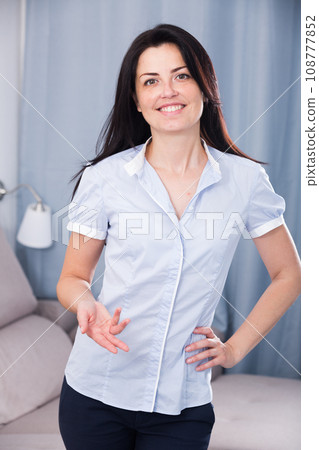 smiling female offering one's hand indoors 108777852