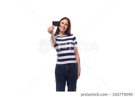 charming young european woman with black straight hair in a striped black and white t-shirt and charming young european woman with black straight hair in a striped black and white t-shirt and 108778090