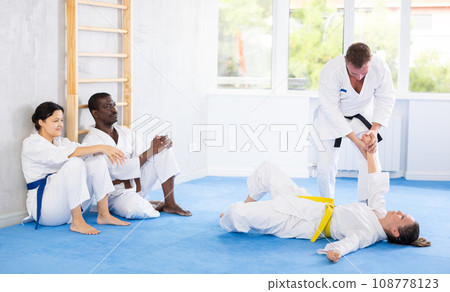 Multinational athletes in pair conduct training battle in oriental fighting technique 108778123