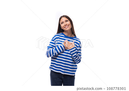 pretty young slim european model woman dressed in a blue sweater on a white background 108778301