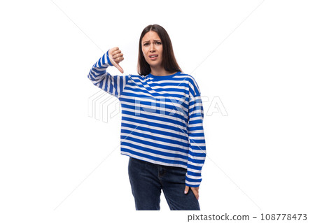 young stylish brunette lady in a striped blue turtleneck on a white background with copy space 108778473